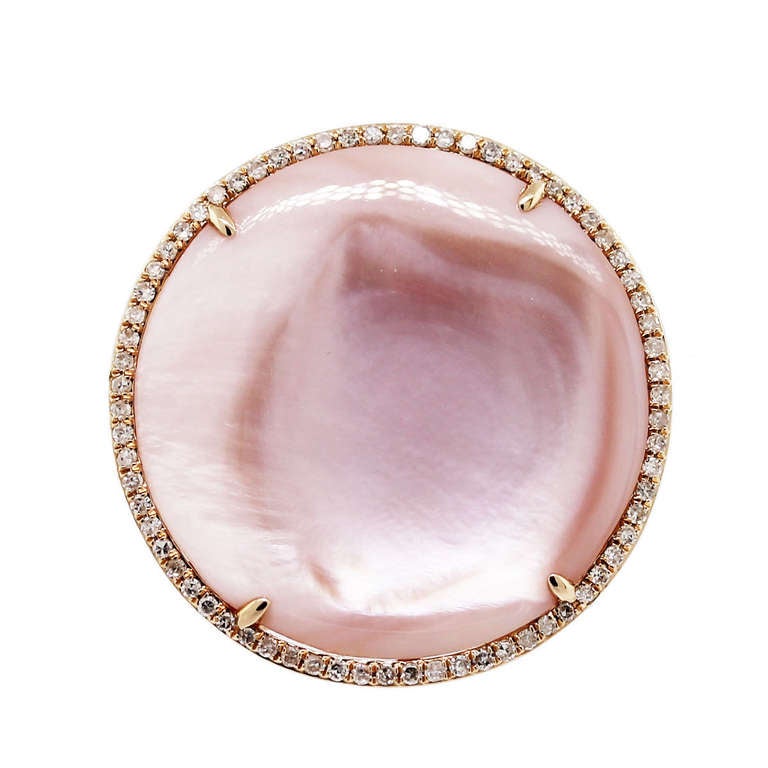 Style: 14k Rose Gold Pink Mother of Pearl Diamond Ring
Diamonds: Approximately 0.28ctw of Round Diamonds.
Gemstones: One Mother of Pearl Slice. 23mm in diameter
Ring Size: Size 7 (can be sized)
Total Weight: 6.4dwt (9.9g)
Retail Value: