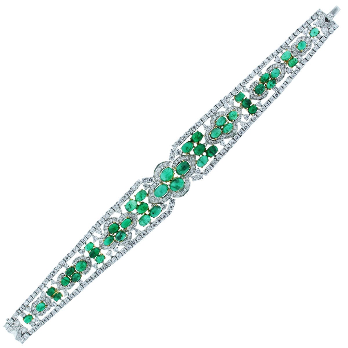Style: Style: Platinum 6.5ctw Diamond Emerald Ladies Bracelet
Diamond Details: Approximately10.03ctw (357 diamonds total) of Round Brilliant Diamonds. Diamonds are G in color and VS2-SI2 in clarity.
Gemstone Details: Approximately 22.22ctw (44