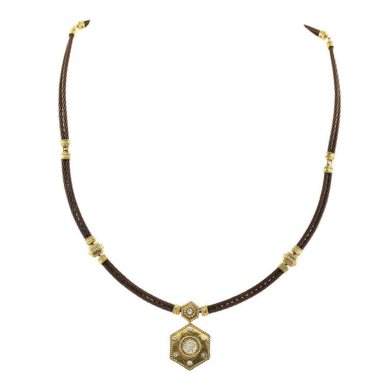 Style: 18k Gold and Diamond Charriol Celtique Collection 2 Row Bronze Cable: Necklace
Collection: Celtique Collection
Company: Charriol
Material: 18k Yellow Gold and Bronze Plated Stainless Steel
Diamond Weight: Approx 0.44ctw
Diamond Color: