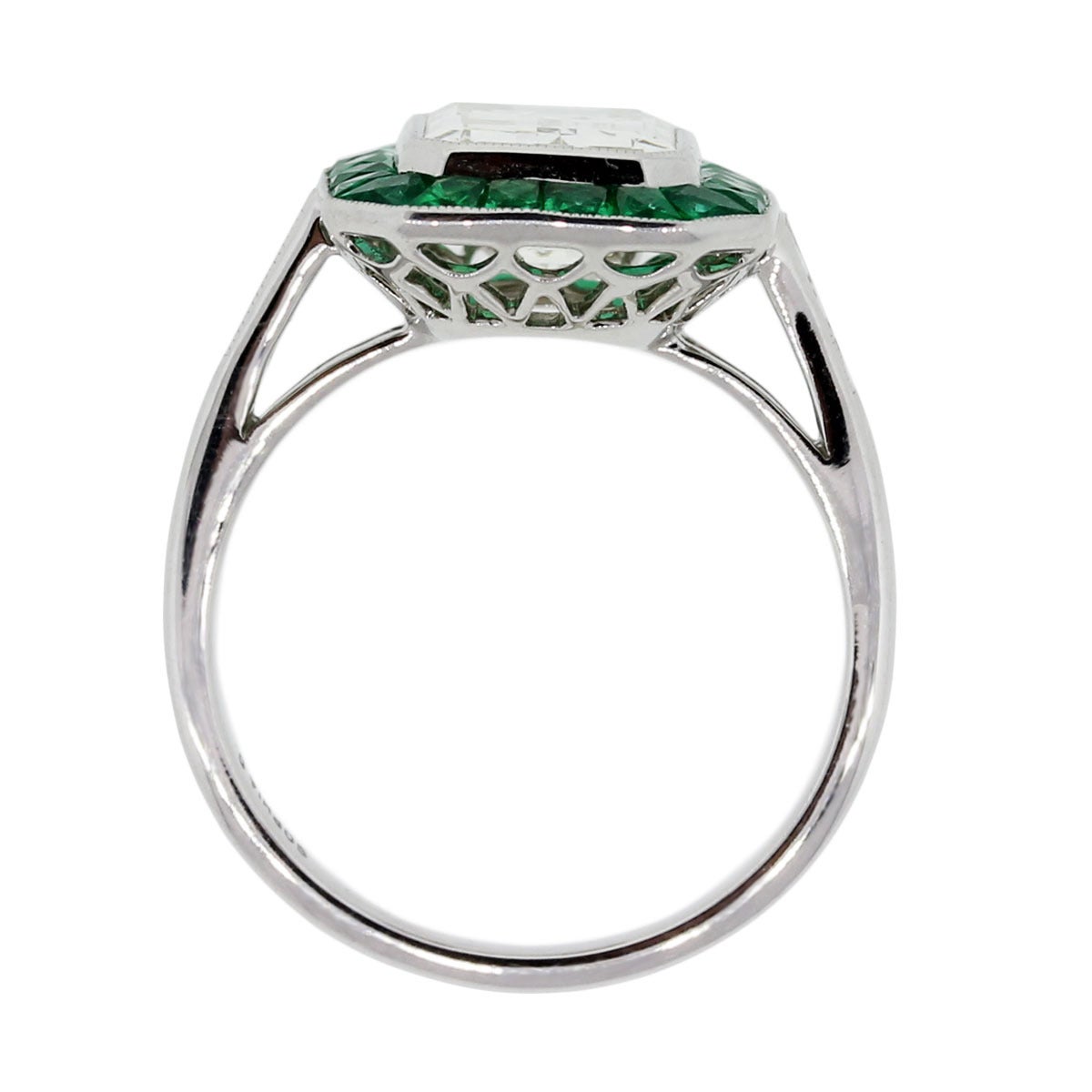Style: Platinum 2.51ct Emerald Cut Diamond Emerald Halo Ring
Material: Platinum
Center Diamond Details: 2.51ct Emerald Cut Diamond. K in color and VS2 in clarity
Mounting Diamond Details: Approximately 0.14ctw of Asscher cut diamonds. G in color