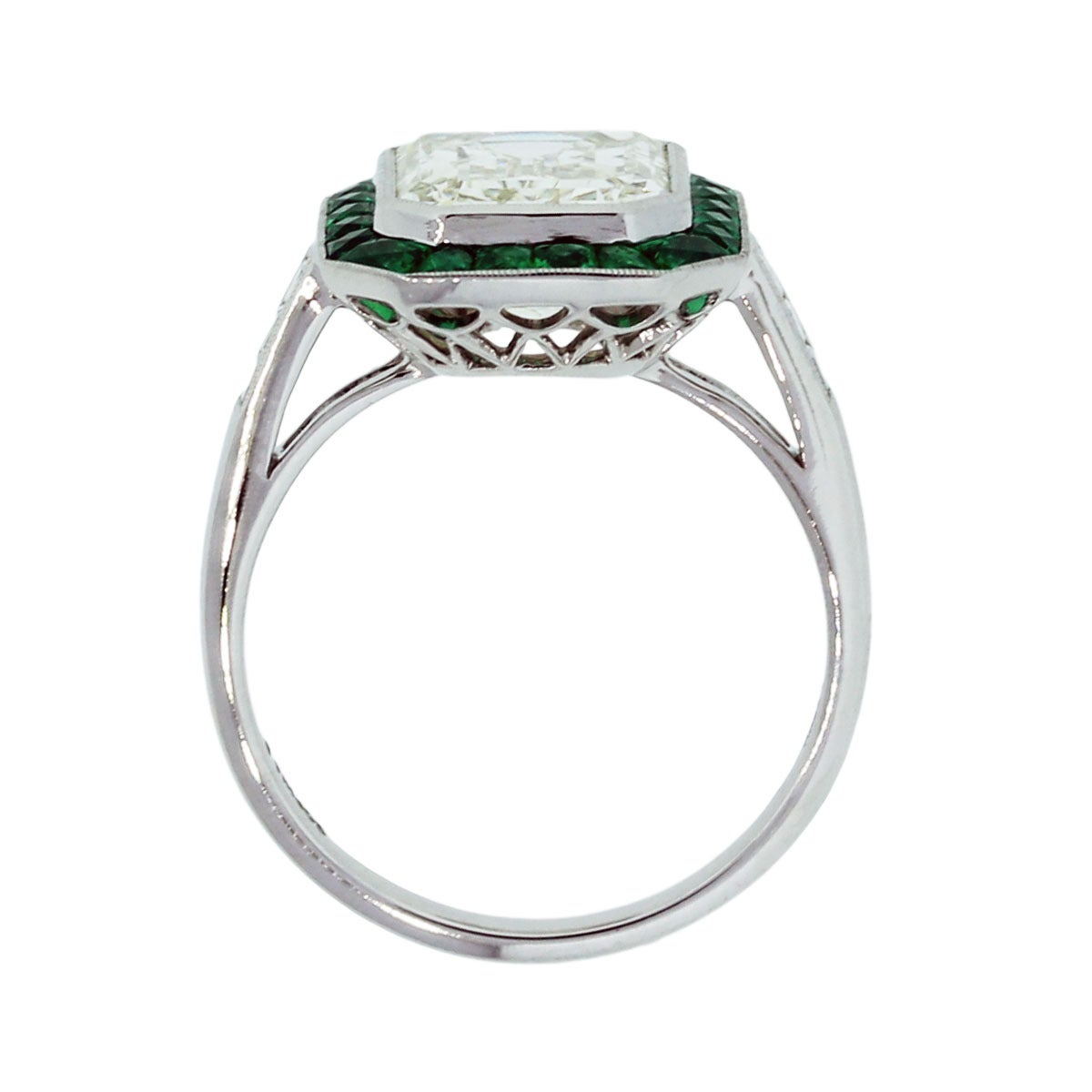 Style: Platinum 4.12ct Diamond Emerald Halo Engagement Ring
Material: Platinum
Center Diamond Details: 4.12 Emerald Cut Diamond, Diamond is J in color and VS in clarity
Mounting Diamond Details: Approximately 0.13ctw of Princess Cut Diamonds,