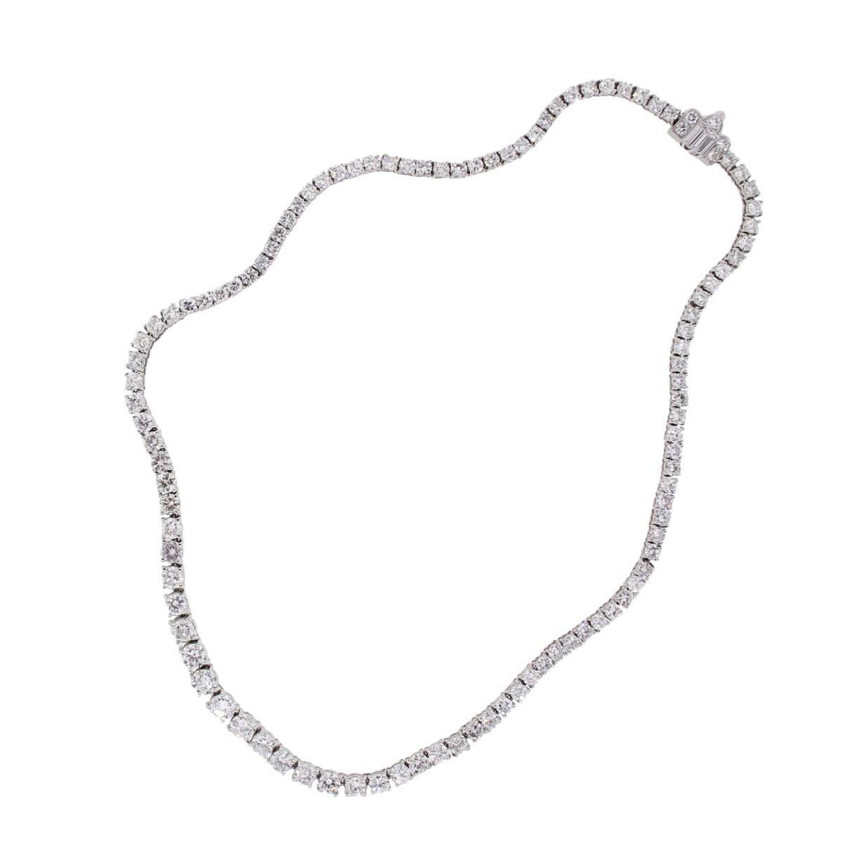 Material: Platinum
Diamond Details: Approximately 10ctw of round brilliant diamonds and baguette shape diamonds. Diamonds are H/I in Color and SI in Clarity
Total Weight: 28.6g (18.3dwt)
Necklace Length: 15.25