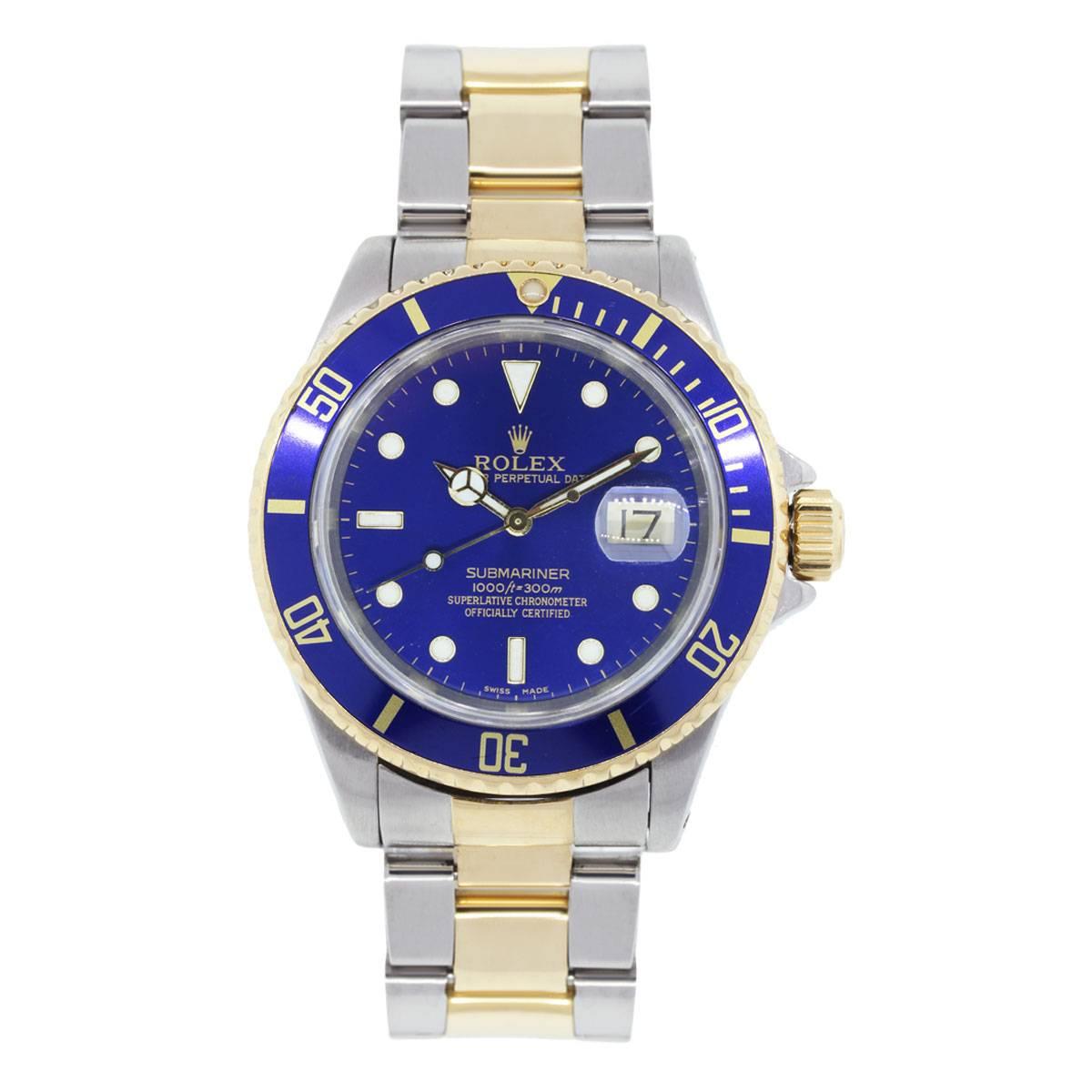 Brand: Rolex
Style: Submariner
MPN: 16613
Serial: S serial
Case Material: Stainless steel
Case Diameter: 40mm
Bezel: Unidirectional blue bezel
Dial: Blue index marker dial with luminescent markers and date window at the 3 o'clock position
Bracelet: