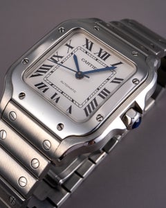 Orologio Cartier Santos in acciaio inossidabile con quadrante bianco sporco e numeri romani, modello medio