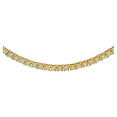 Collier « tennis » en or jaune 14 carats, orné d’un diamant naturel rond de 6,30 carats, taille brillant