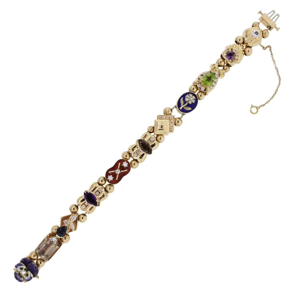 Material: 14k yellow gold
Diamond Details: Approximately 1.20ctw of round brilliant diamonds.
Gemstone Details: Topaz, smoky quartz, sapphire, aquamarine, peridot, amethyst
Fastening: Double tongue in box clasp with safety chain
Measurements: Will