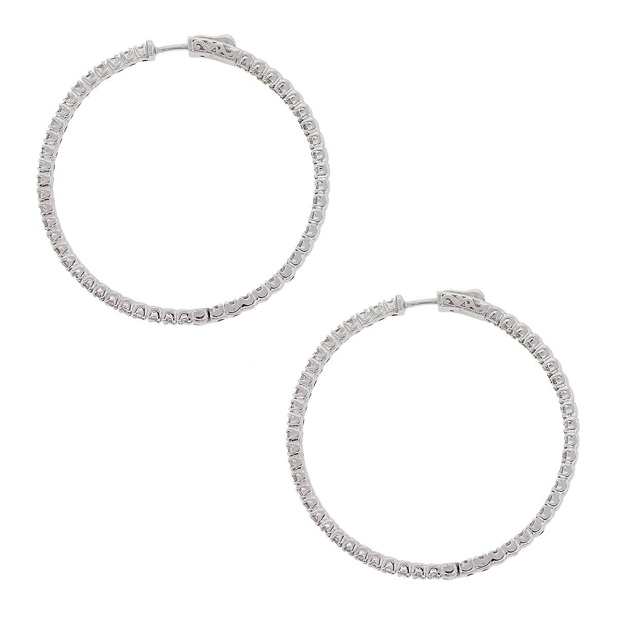 Material: 14k white gold
Style: Inside out extra large hoop earrings
Diamond Details: Approximately 5ctw of round brilliant diamonds. Diamonds are G/H in color and SI in clarity.
Earring Measurements: 2″ x 0.13″ x 2″
Total Weight: 19.3g