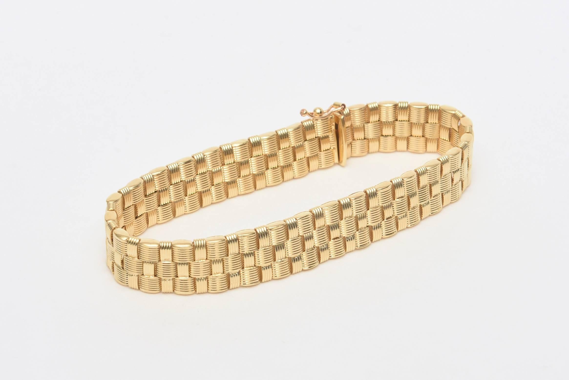 This lovely woven 14 K yellow gold bracelet has elegance and simplicity. It is marked Italy. It is 13 DWT or penny weight. When opened it is 7.5