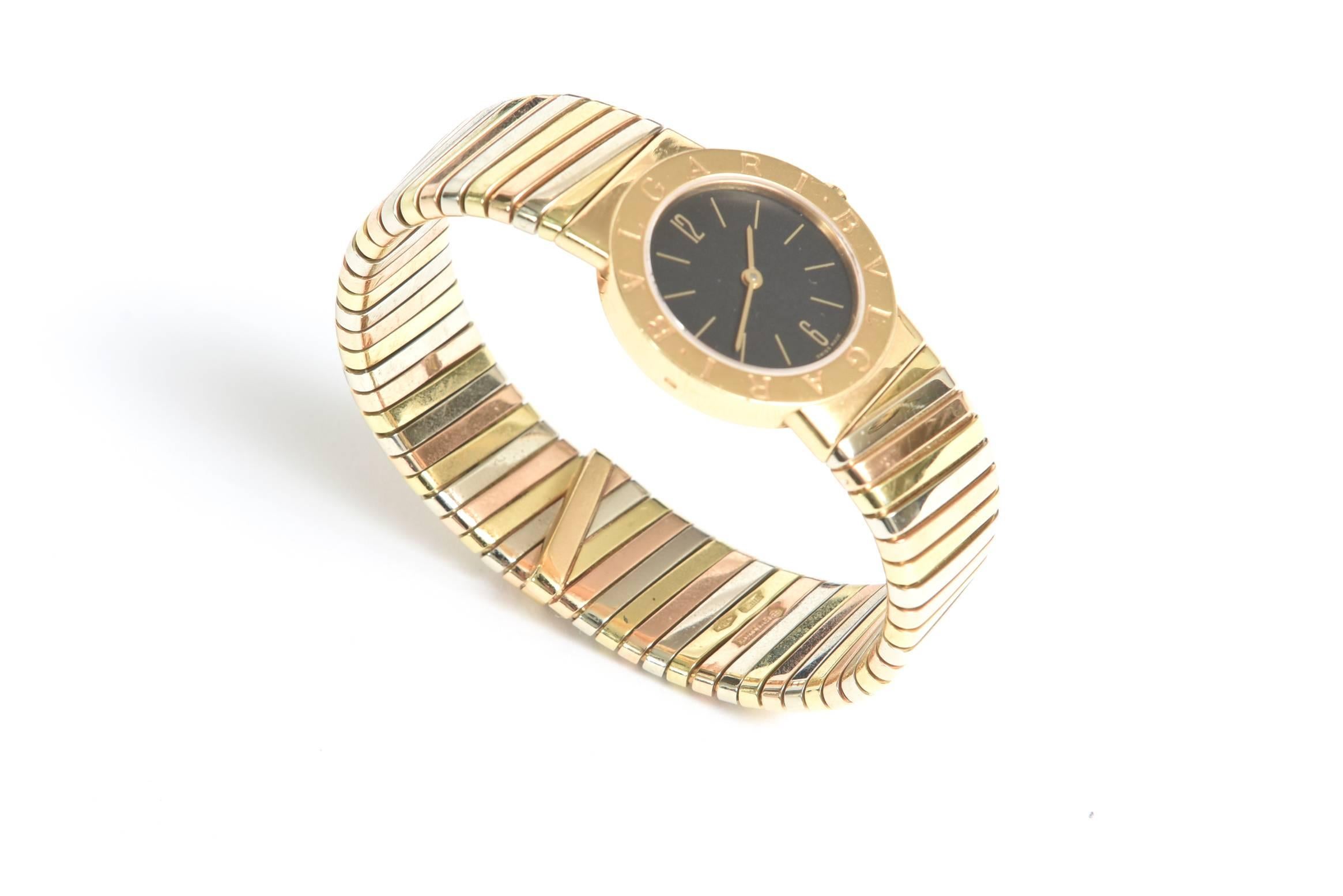 This classic and timeless Bulgari Tubogas Tri-Color gold ladies watch is of 3 golds: rose, white and yellow gold. It is from the mid 1900's. It has a black quartz case.The style number is BB262TYGYA. It has been re-polished by Bulgari. The
