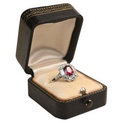 GIA 1.75 Carat Oval Cut Heated Tanzanian Ruby Ring. Diamond Halo Platinum Ring