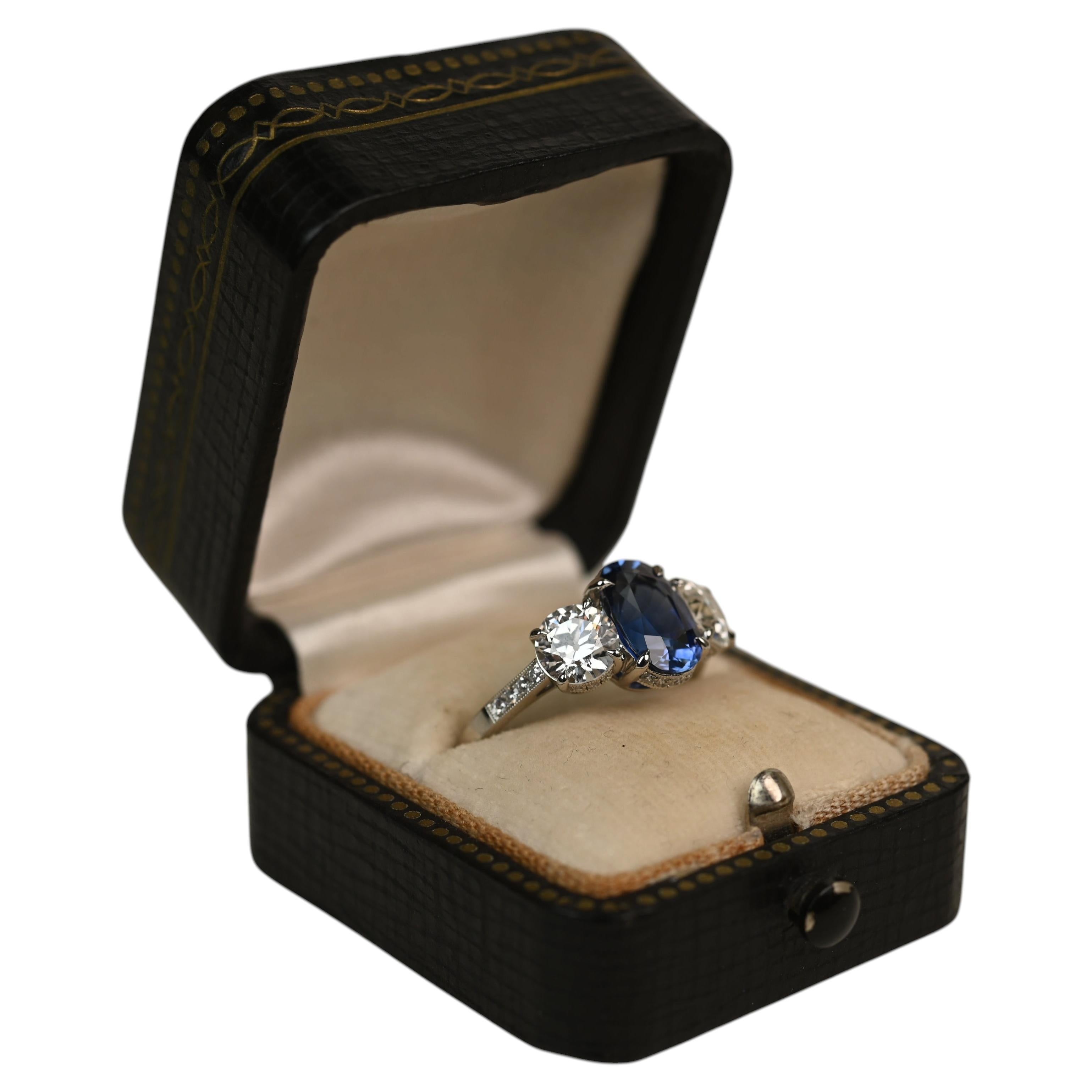 2.30 Carat Oval Cut Sapphire Ring. 1.30ct Diamond Three Stone Ring Platinum For Sale