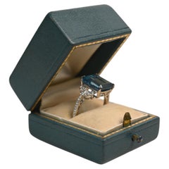5 Carat Emerald Cut Blue Topaz Ring. Round Diamond Accent 18k White Gold Ring