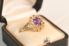 Vintage 0.70 Carat Round Cut Amethyst Ring. Floral Motif 14K Yellow Gold