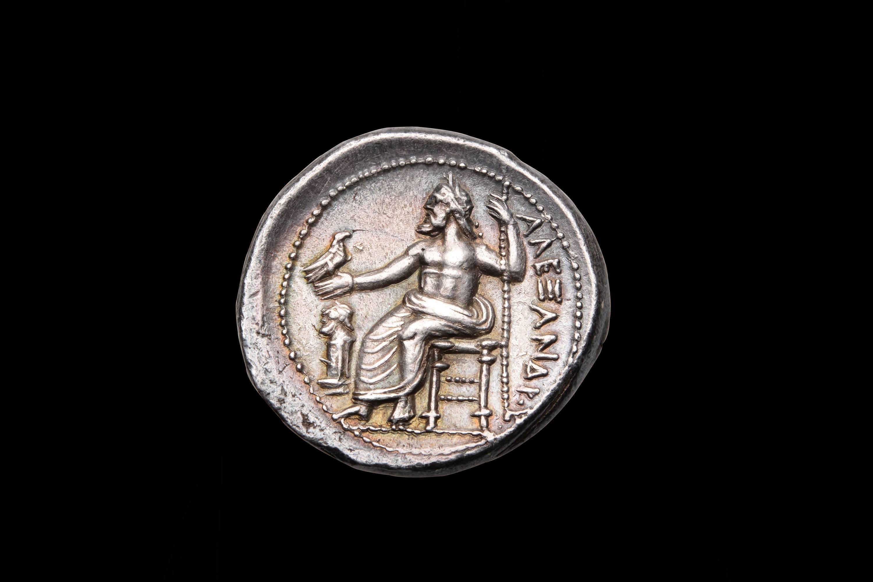 A beautiful and highly desirable lifetime issue Alexander the Great tetradrachm. Struck at the Amphipolis mint, during Alexander's lifetime, circa 325 - 323 BC.

The obverse with a refined, naturalistic portrait of the demigod Herakles. He is
