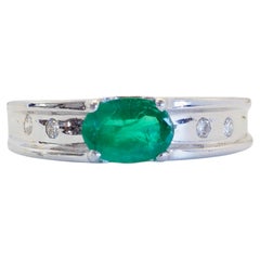 18K White Gold 0.70ct Oval Emerald & 0.10ct Diamond East-West Band Ring