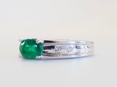 18K White Gold 0.70ct Oval Emerald & 0.10ct Diamond East-West Band Ring