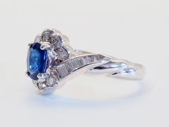 18K White Gold 0.60ct Oval Blue Sapphire & 0.40ct Diamond Halo Ring