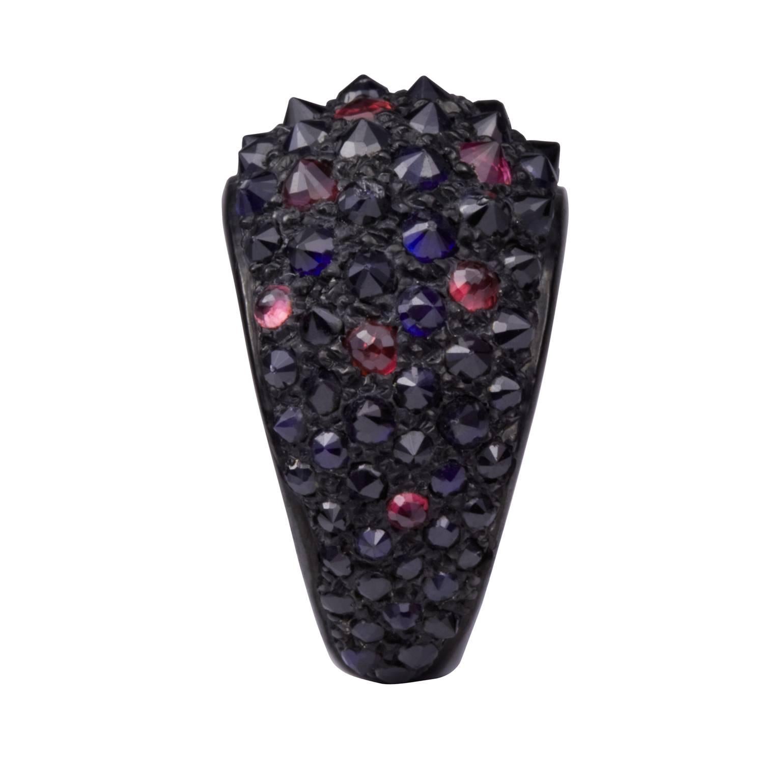 From Hannah’s iconic inaugural collection entitled ‘It’s Only Rock N’ Roll’, this ring is a stand out collector’s piece. Sapphires and rubies are set into 18 kt gold, their colours enhanced by the black rhodium that surrounds them.

Turning