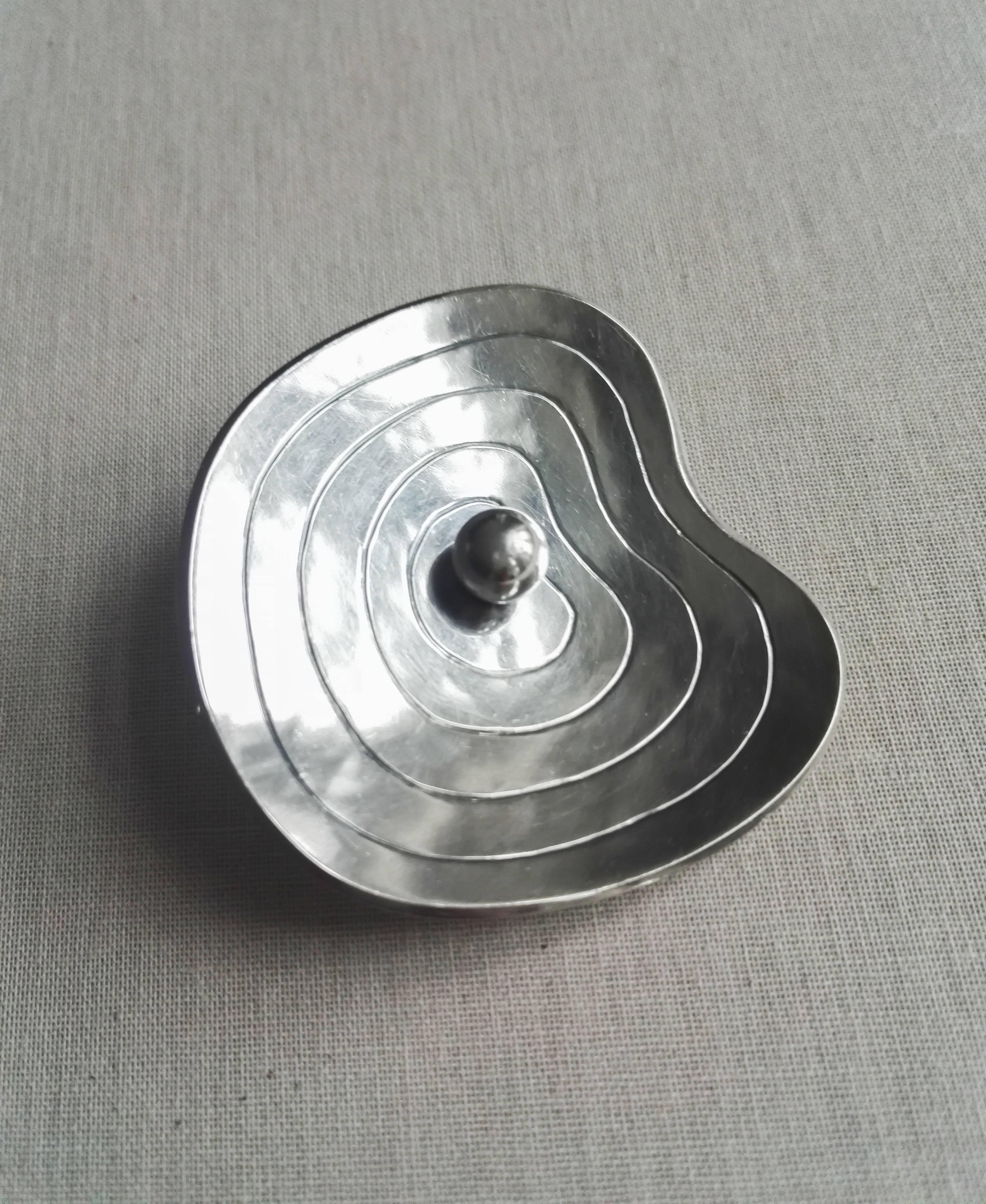 Early sterling silver brooch by renown Swedish silversmith and jewelry designer Sigurd Persson. 

Stockholm, ca 1942

Sterling Silver 

Unusual free-from shape is in interesting contrast to more geometric and straight-lined design which Sigurd