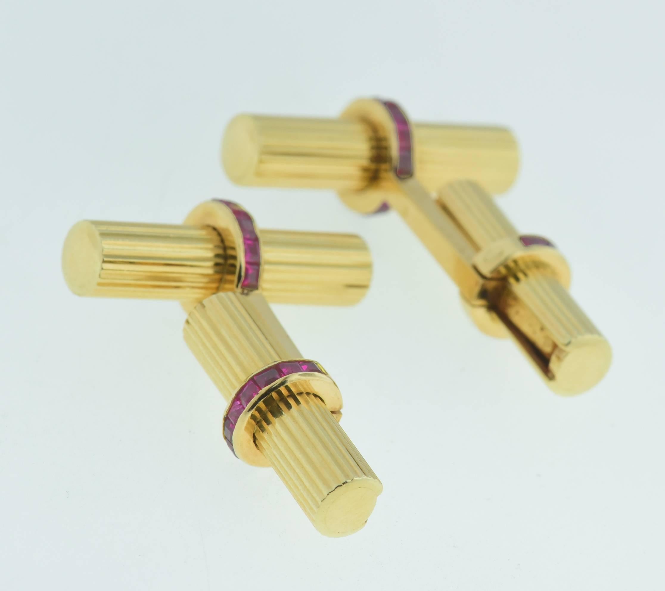 Elegant Vintage Double Bar Cufflinks,by Van Cleef & Arpels; circa 1970's. Crafted in14k yellow gold, set with vibrant & beautiful calibré-cut rubies. Cufflinks signed V.C.A, NY, 14K, serial#12v3.30.