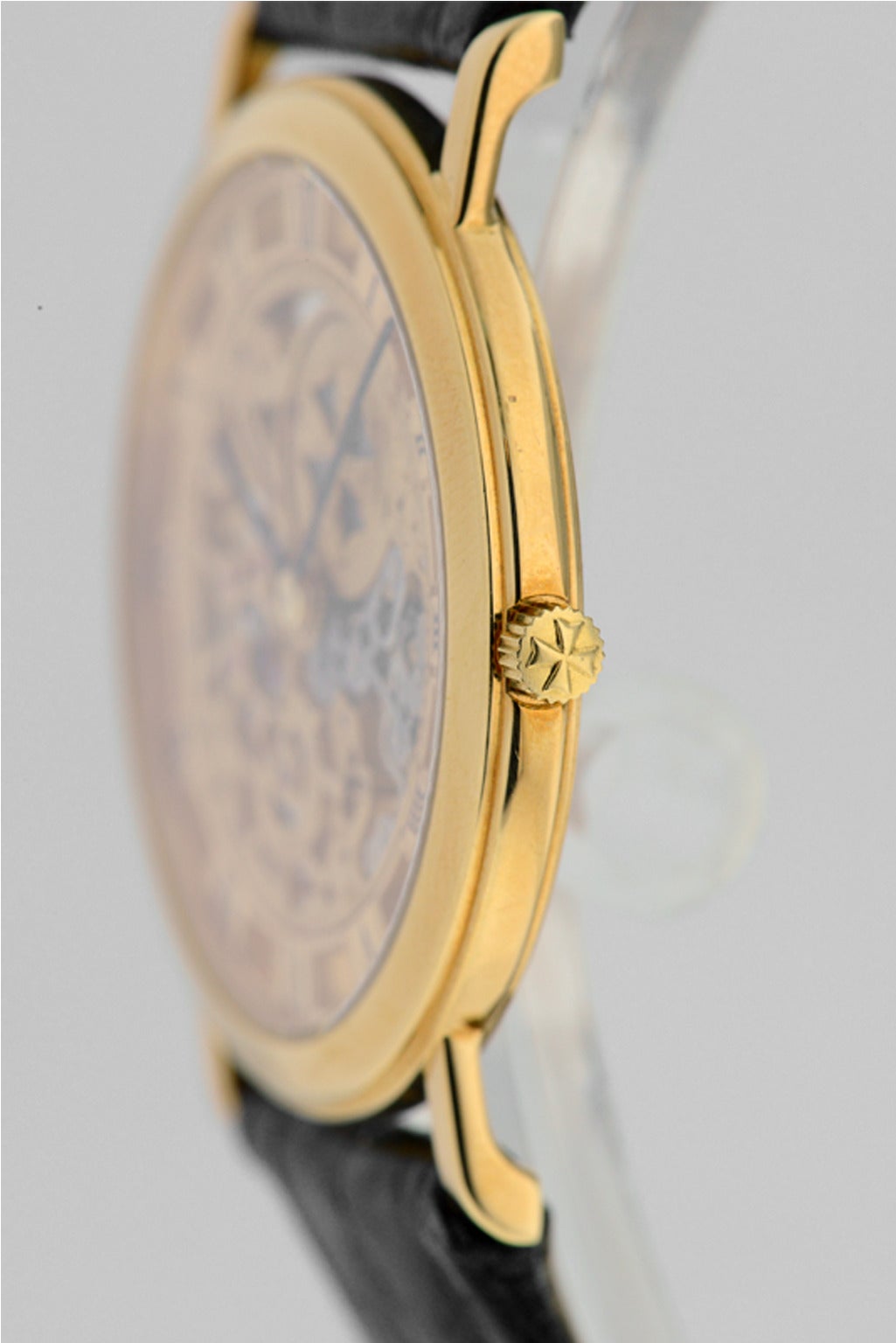 Gents Vacheron Constantin Skeletonized watch in 18K yellow gold, Ref#33115/000J/8385. On original reptile strap with original 18K yellow gold tang buckle, snap on caseback, 33mm case diameter. Manual winding movement. Skeletonized dial with painted