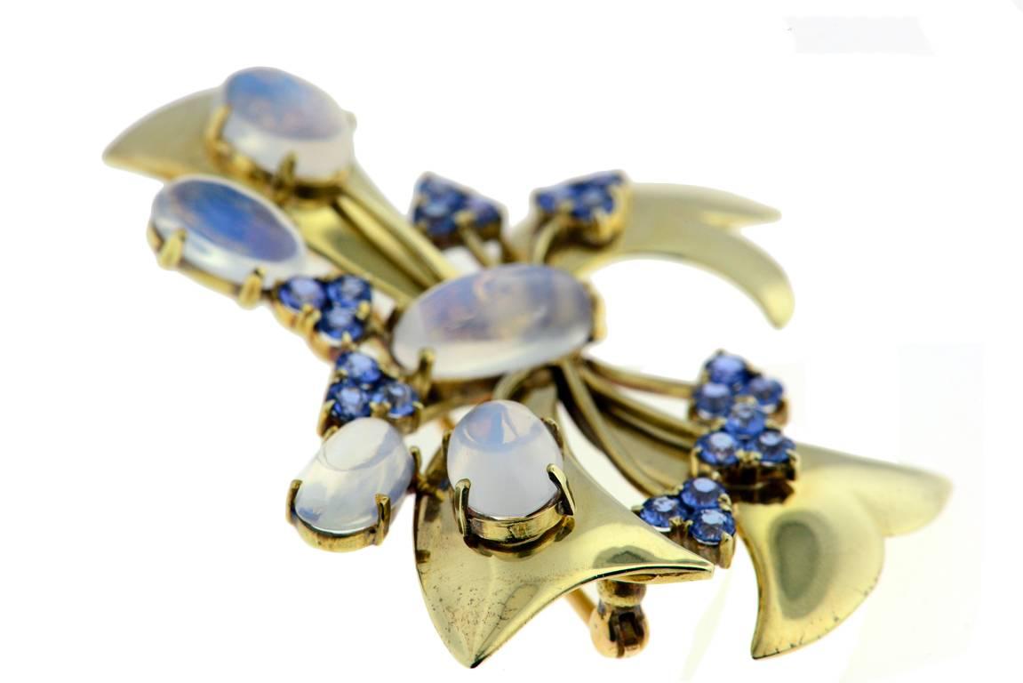 14K pin set with montana sapphires and moonstones. Signed Tiffany & Co. Circa 1940's