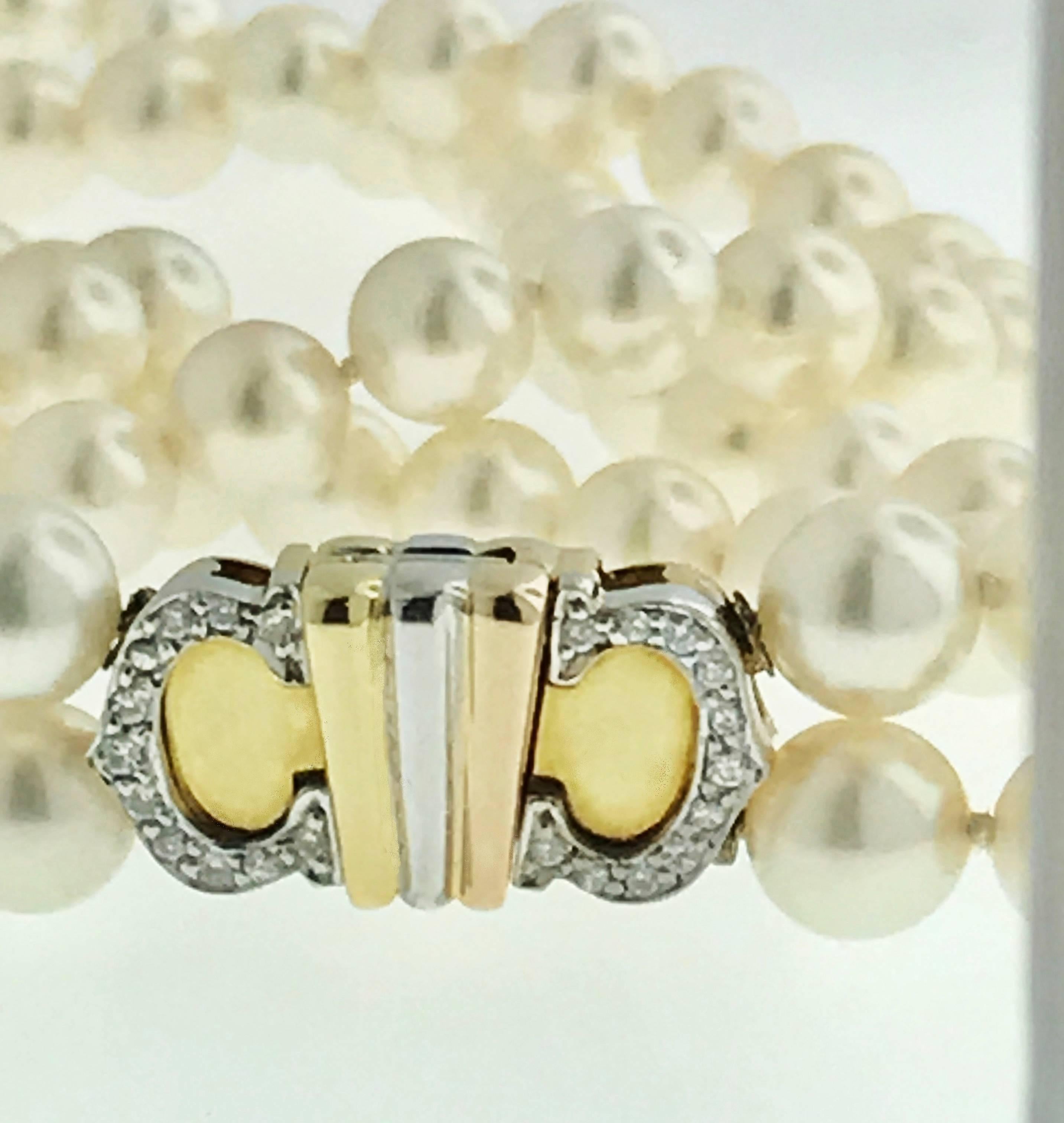 Vintage Cartier Double 'C' Motif Clasp Cultured Double Strand Pearl Necklace.Necklace is comprised of beautiful Double strand of cultured pearls; aprox 6mm ea with a beautiful creamy-pinkish lustre. Necklace is 16