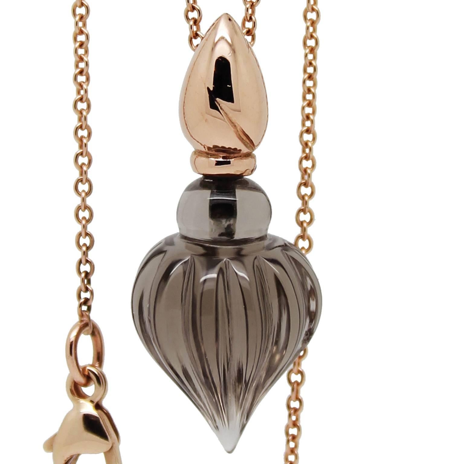 Hand carved Smoky Quartz perfume bottle styled pendant with 9k Rose Gold lid and 9k Rose Gold chain. Chain length 70cm (28 inches), adjustable to 45cm (18 inches). Stone measurements 18mm height (28mm including lid) x 12mm width. William Cheshire