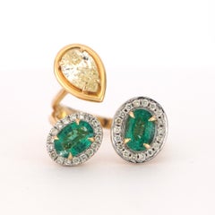 14K Yellow Gold Ring with 1.57ct Oval Emerald and 0.91ct Yellow Natural Diamond