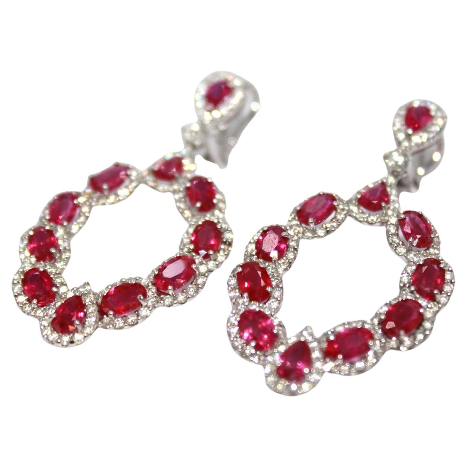 13.32 carats oval & pear-shape Burma Ruby with 250 round diamonds, totaling a diamond weight of 4.00 carats. 

This stunning Ruby & Diamond Earring will highlight your uniqueness and elegance. 

Item Details:
- Type: Earring
- Metal: 18K Gold
-