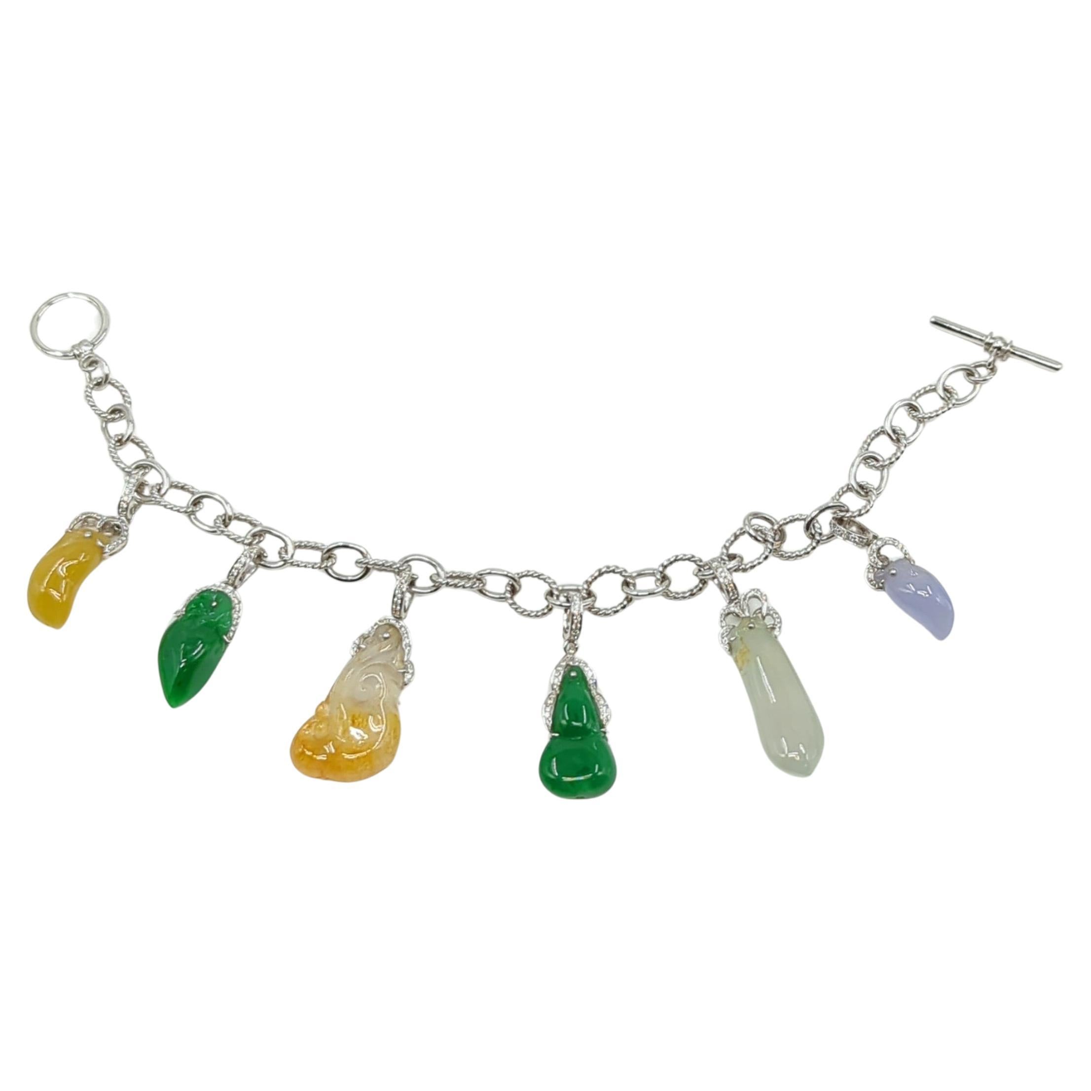 This 18k white gold ladies' jadeite charms bracelet is a rare and versatile masterpiece, weighing in at 35.32 grams. The bracelet showcases six meticulously handcrafted A-grade jadeite charms, each in a unique motif and color palette—two in rich
