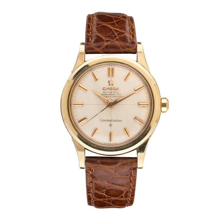Omega gilt top and stainless steel back Constellation wristwatch, 24 jewels, calibre 561, automatic movement, with sweep center seconds, circa 1960s.

Omega has been the official timekeeping device of the Olympic Games since 1932. James Bond has