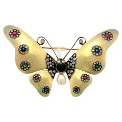 Broche vintage en forme de papillon en or jaune 18 carats, sertie de saphirs, de rubis, d'émeraudes et de diamants