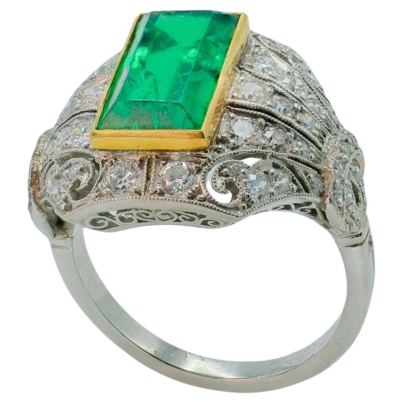 Natural columbian emerald minor oil 2.98 carats in a platinum setting with 18k yellow gold lining and 1.28 carats of GH color and VS clarity diamonds. 

Columbian emeralds are one of the most sought after stone due to their scarce nature in the