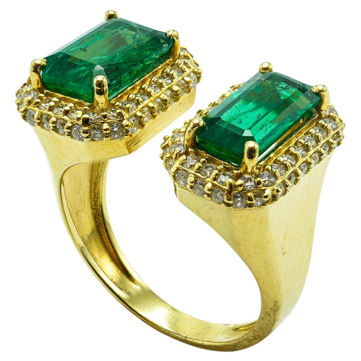 Two-Stone Emerald and Diamond 18 Karat Yellow Gold Emerald Cut Ring For Sale