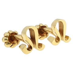 Boutons de manchette Cartier « Leo Zodiac », vintage, en or jaune 18 carats