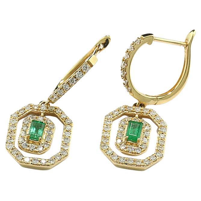 a pair of earrings,  shape: round and octagonal, with 2 octagonal cut emeralds appr. 0,35 carat in total, luscious green in transparent quality, 94 natural brilliant cut white diamonds approx.  0,78 carat in total, color: H-I, clarity: SI-p1.