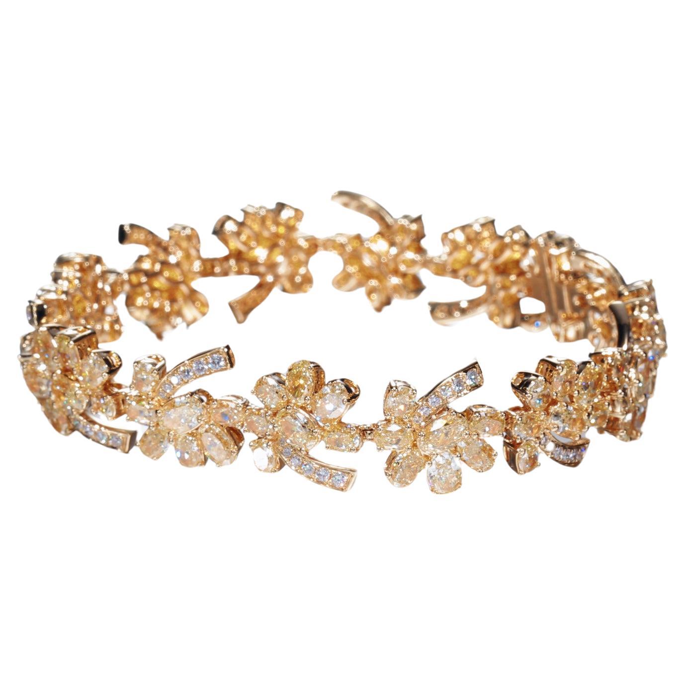 Exquisite Diamond and Gold Floral Bracelet

Features:

Center Stones: 
12.127 ct Total weight, 
100 pieces

Round White Diamonds:
0.50 ct total weight, 
86 pieces

Gold Weight: 19.32 grams
Total Weight: 21.85 grams

Indulge in the luxury of natural