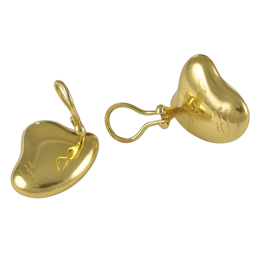 The Full Heart design is stamped Tiffany & Co  Elsa Peretti  750  Spain
and the style is plump and rounded and they are not heavy and are comfortable to wear.
Dimensions: About 1 inch at the widest part.       Condition: Good
American circa