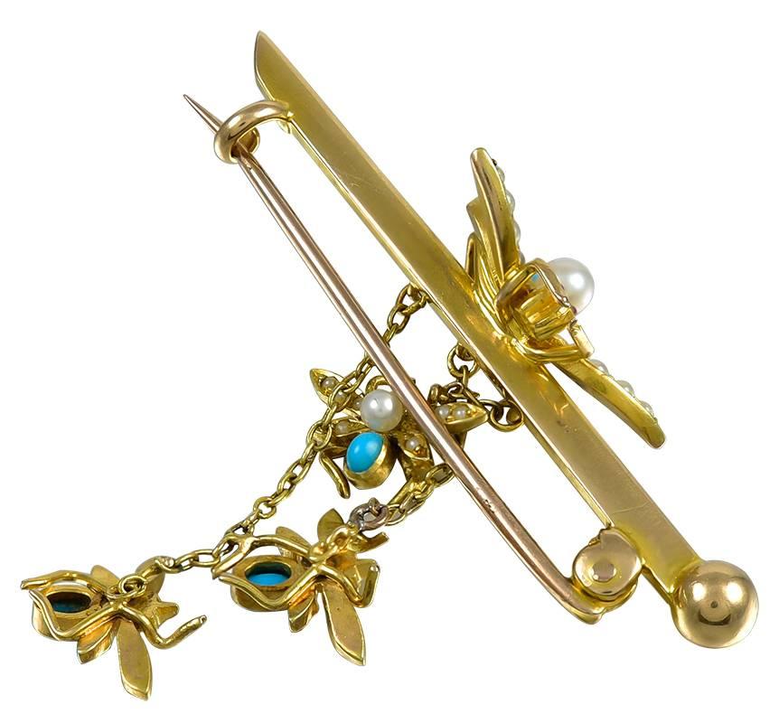 This charming Victorian brooch is set with 4 fine Persian Turquoise and the little bees each have 9 Pearls and the Mother Bee has 15 Pearls and Cabochon Ruby eyes. All the little Bees are joined with Gold chain and the brooch is in good condition,
