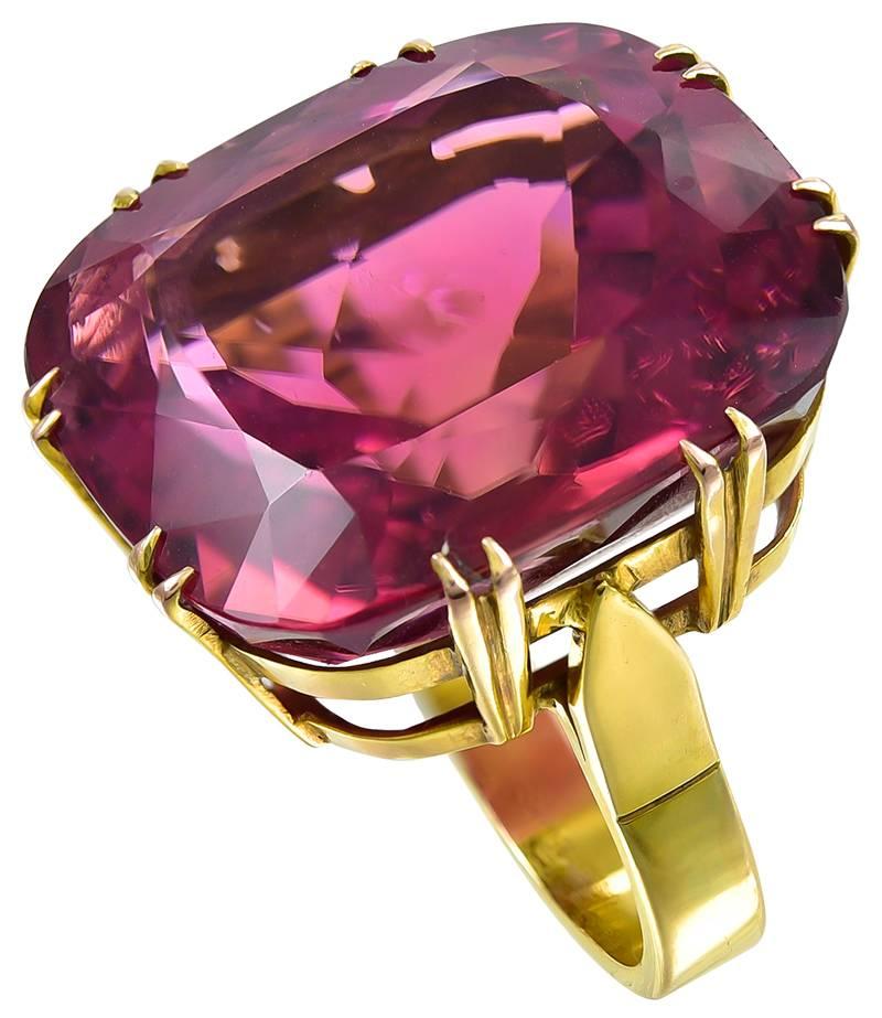 The large and beautiful 56 carat stone displays Mauve, Brown, Peach and Pink, depending on the angle when viewed or the movement when worn.
The Gem is set in a substantial Gold mount stamped 585, a European Gold mark for 14k Gold.
This is an