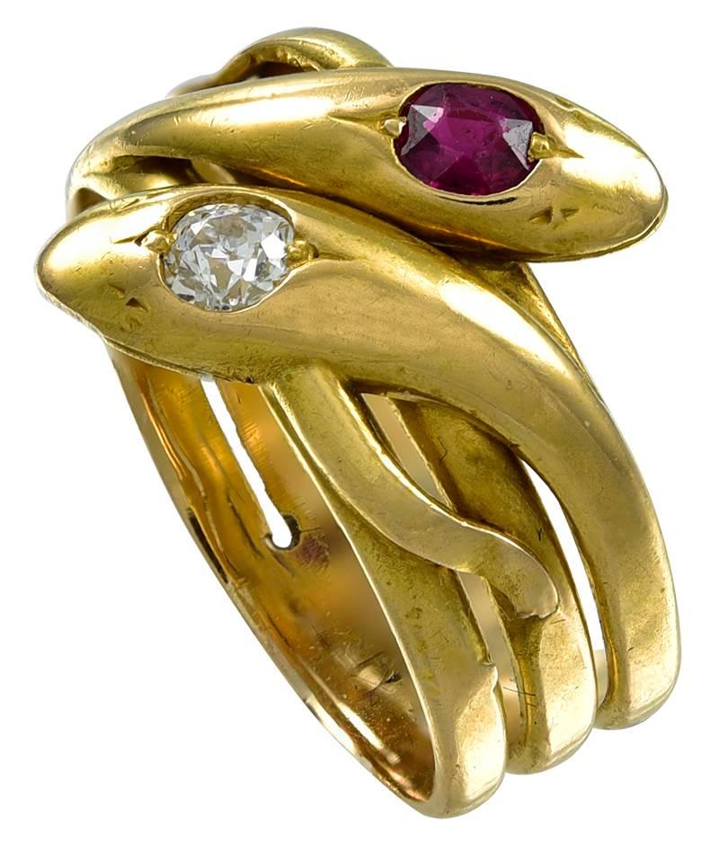 This Victorian Snake Ring is set with an old European Cut Diamond and a beautiful Ruby, which may be of Burma origin. Both serpents have closed mouths and a sleepy expression and the Ring is made of unmarked 18K Gold and could well have been an