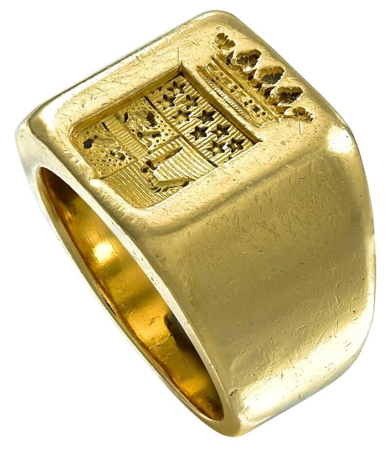 The rectangular head is engraved with a Shield and within, a Lion rampant, nine stars and an Knights arm holding a Sword and above a Crown with five finials.
The Ring has wide shoulders (1.2cm) and shank (6mm). There is a standing Owl 
(Hibou)