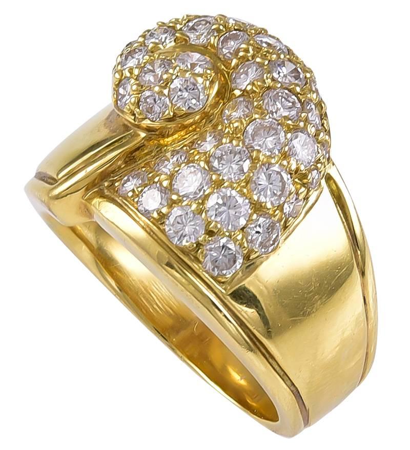 The Wave, in tribute to Hokusai? set with over 30 Diamonds, to a substantial wide shouldered shank, the inside stamped twice B S & F and 18K .
An unusual looking Gold and Diamond Ring.
Condition: Good
Weight: 10.4g
Finger size:    US  6      UK 