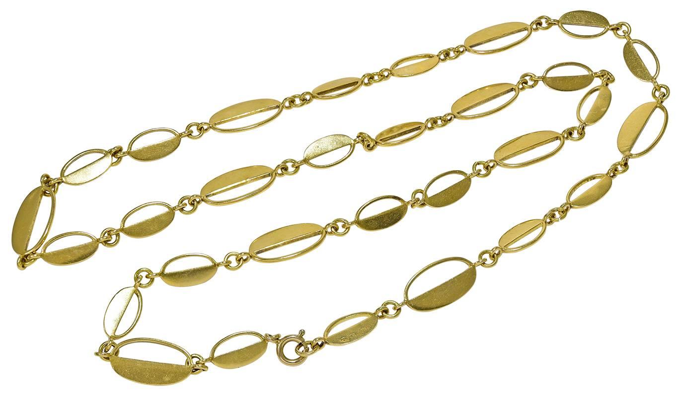 Made with 30 oval cut out sections, 10 large and 20 smaller which together create a very interesting  Neck Chain. Near the clasp are the marks 18K  ITALY 347 AL
Condition: Good
Weight: 56.2g
Length: 15 inches
Italian: circa 1970's