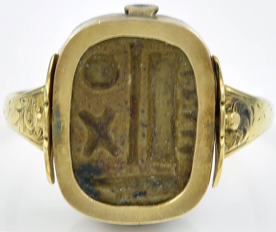The 3000 year old glazed Steatite Scaraboid impressed on one side with the image of a walking animal, possibly an elephant, and with hieroglyphics on the reverse.
The Gold revolving mount with lightly engraved shoulders, dates from the 1820's,