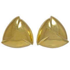 A pair of three sided Gold Earclips