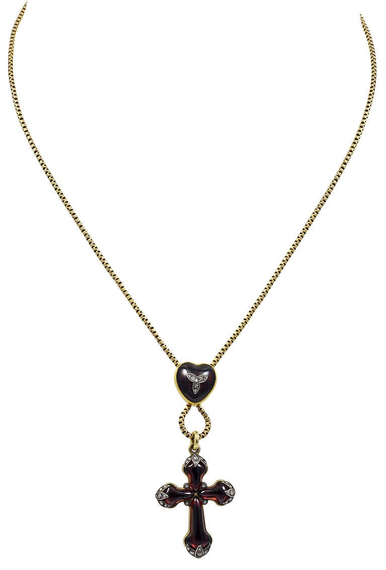 The small proportions and scale of this Heart and Cross Pendant are quite exquisite. The piece is of fine quality and the Cross, although only measuring one inch long, is set with twenty eight Rose Diamonds at the terminals and another six in the
