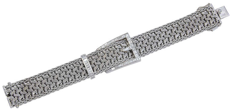 This small size (6 inch) Bracelet is signed Caplan Paris 750 and has thirty six Baguette Diamonds in the buckle and toggle and a further small round Diamond in the clasp.
A very smart Bracelet for a woman with a small wrist.
Condition: