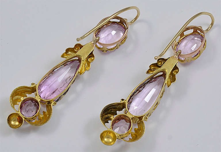Each long drop is set with three Imperial Pink Topaz and decorated with Gold Scrolls , Acanthus Leaves, Gold Ball and slender Gold hook
One of the central Pink Topaz has a small chip at the bottom of the stone not visible to the naked eye.
Very
